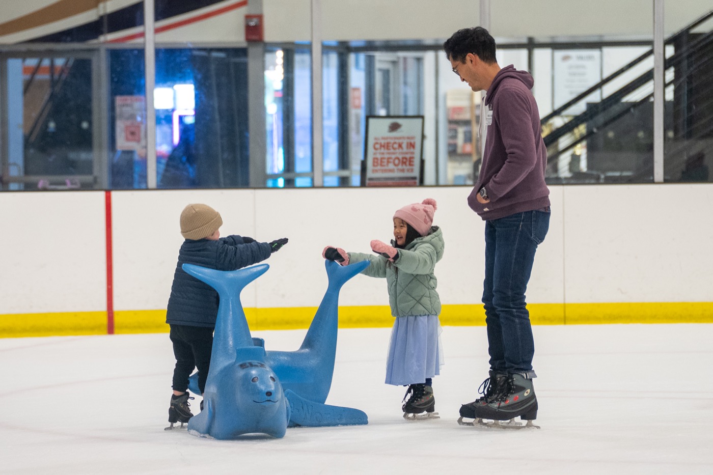 Family enjoying public ice skating at Anaheim ICE